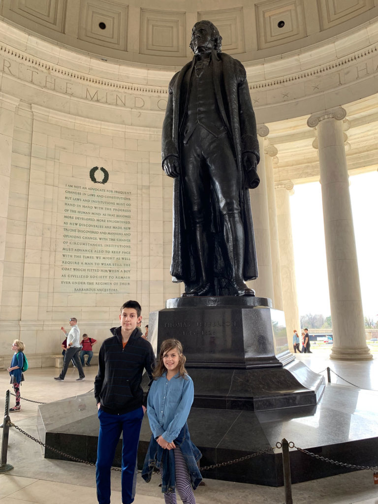 Sam and Sasha next to the statue of Thomas Jefferson